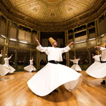 TOPSHOTS TOPSHOTS__Whirling dervishes perform at the Galata Mevlevihane (The Lodge of the Dervishes) in Istanbul on December 18, 2013. The dervishes are adepts of Sufism, a mystical form of Islam that preaches tolerance and a search for understanding. Those who whirl, like planets around the sun, turn dance into a form of prayer.   AFP PHOTO/GURCAN OZTURKGURCAN OZTURK/AFP/Getty Images
